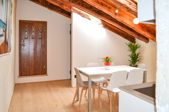 Sala da pranzo appartamento Paesaggi Porta della Muda